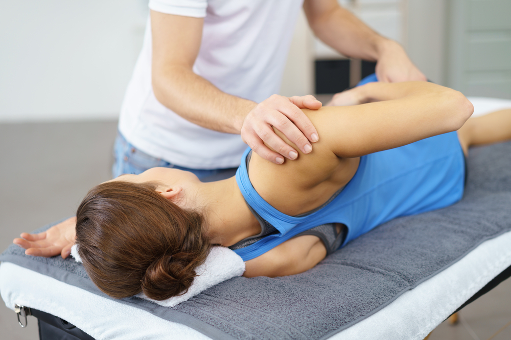 woman laying on her side, a physical therapy using joint mobilization
