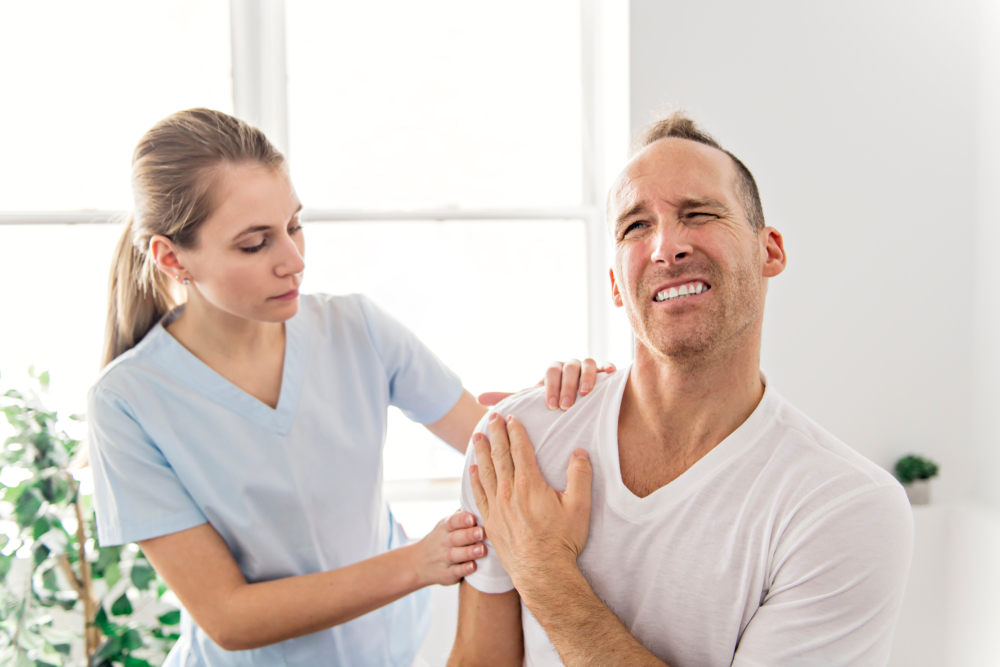 physical therapist helping patient suffering from an over extended shoulder due to ehlers danlos syndrome