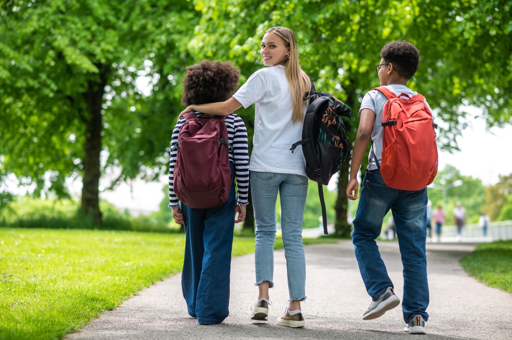 A group of friends carrying backpacks.